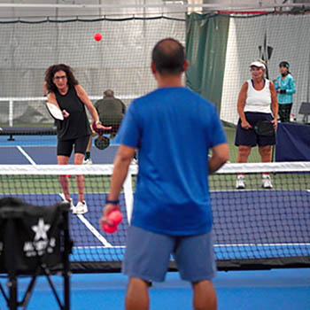 Photo of people playing pickleball